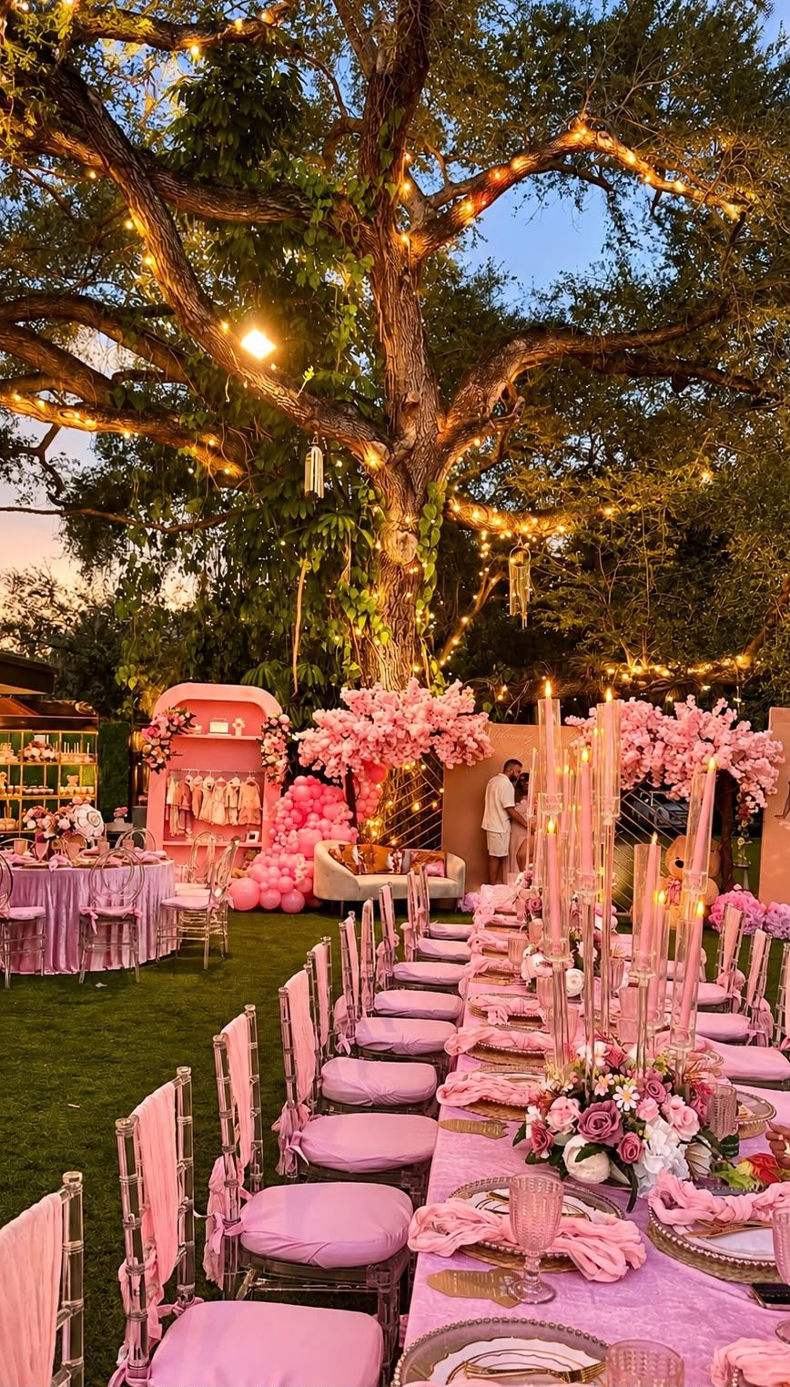 Pink floral table setting for a baby shower