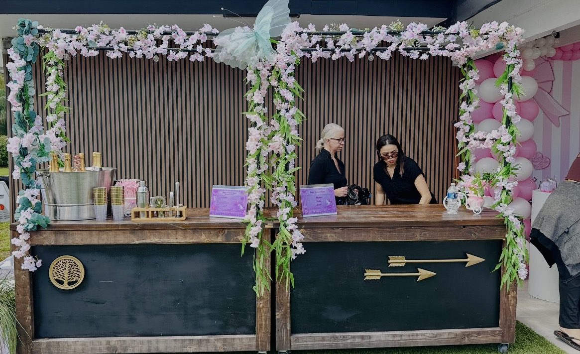 Bar carts set up for drinks service during a celebration